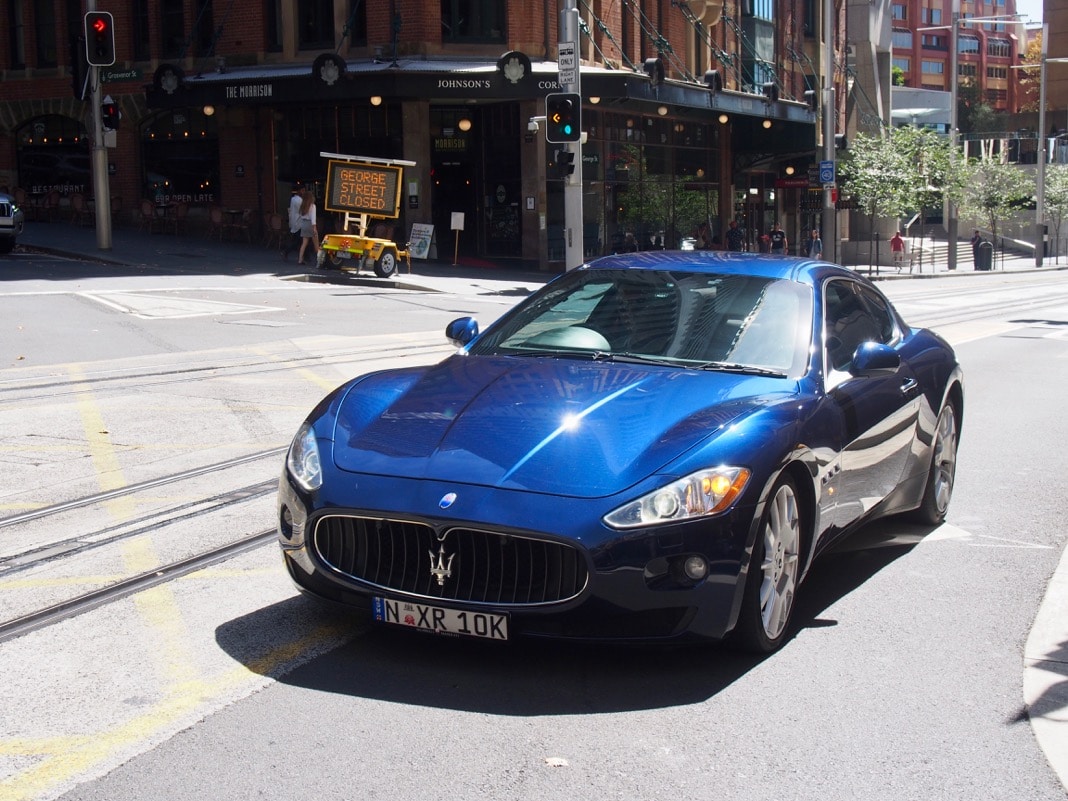 Maserati driving on George Street in Sydney