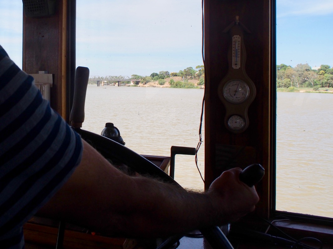 Steering the Captain Proud Paddle Boat on the Murray River