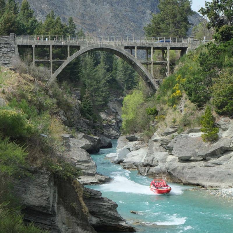 Shotover Jet Boat racing along Shotover River Queenstown