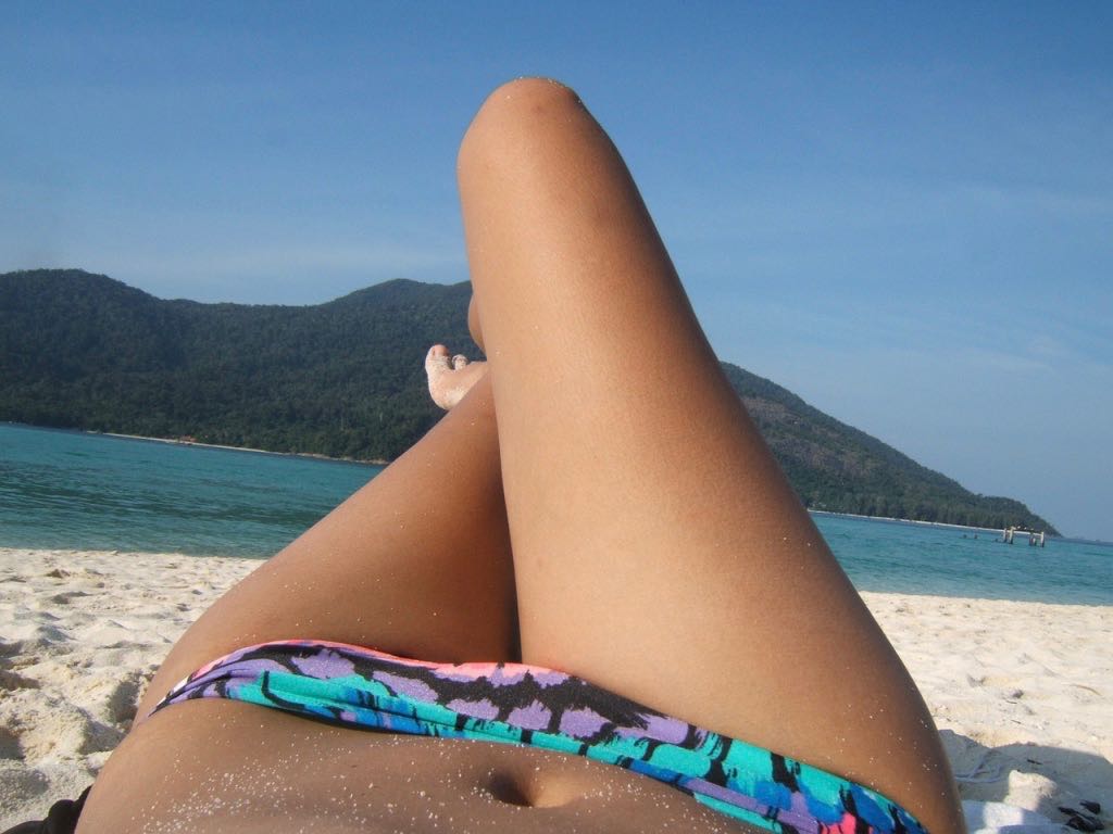 Bikini babe relaxing on Sandy beach