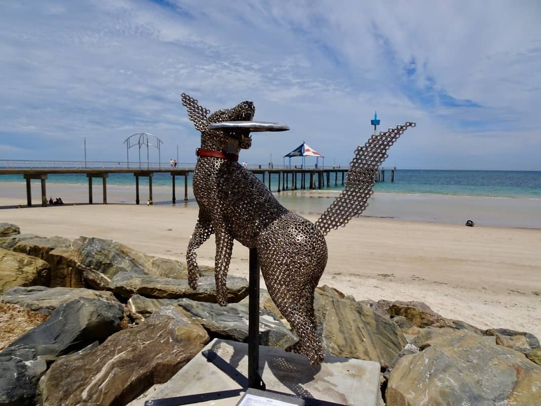 Dog catching frisbee sculpture at Brighton Jetty Sculptures