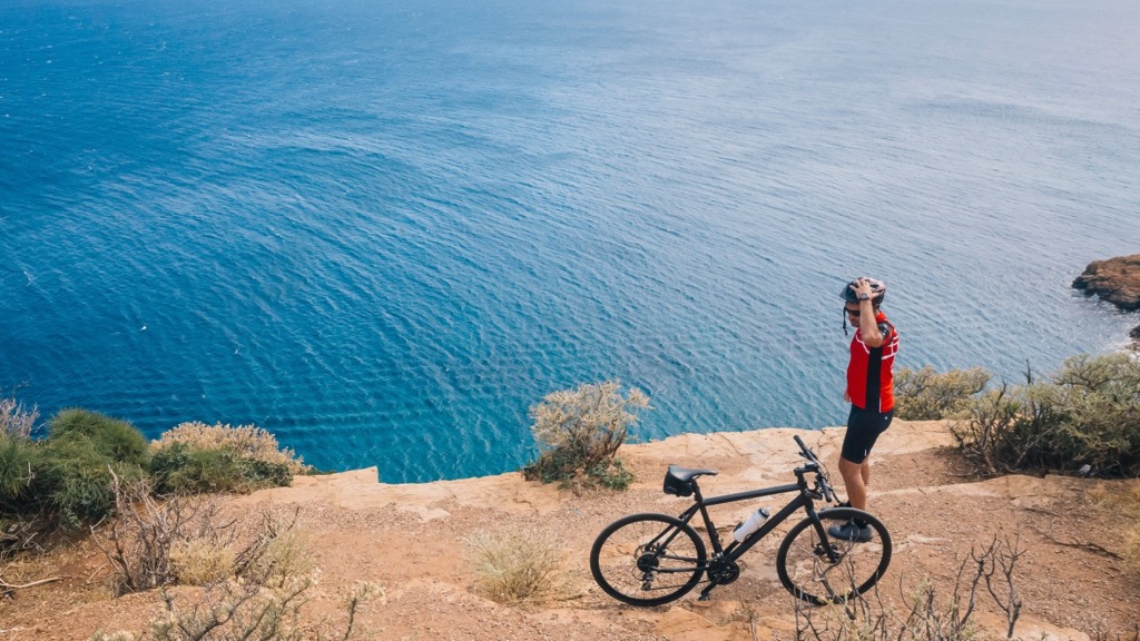 Bike rider at Cape Sounio