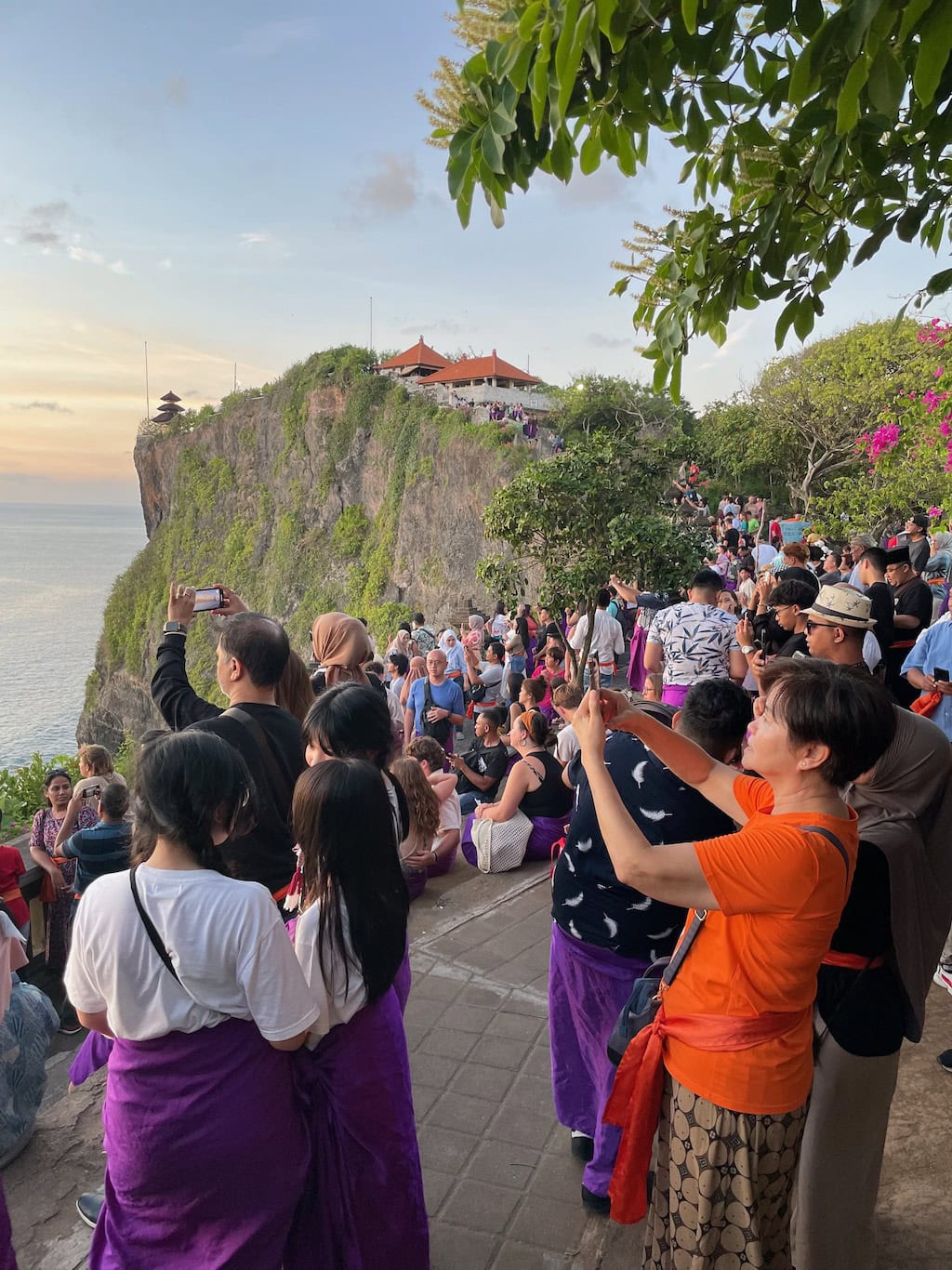 Tourists watching sunset at Uluwatu Temple