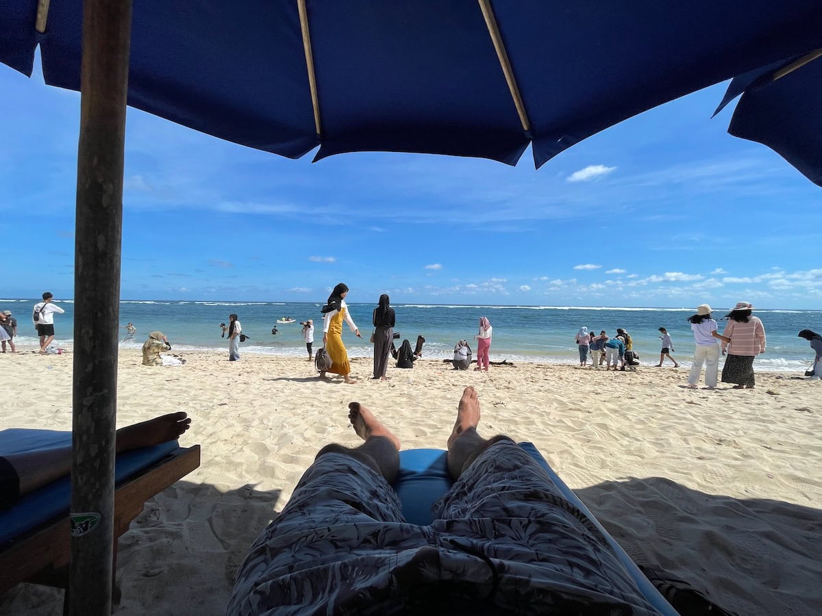 Pandawa Beach with many Muslim Tourists on beach sand