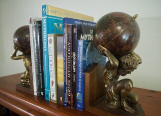 Row of Books about Greek Mythology and Gods held together by Atlas Titan Bookends