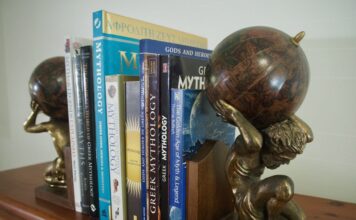 Row of Books about Greek Mythology and Gods held together by Atlas Titan Bookends