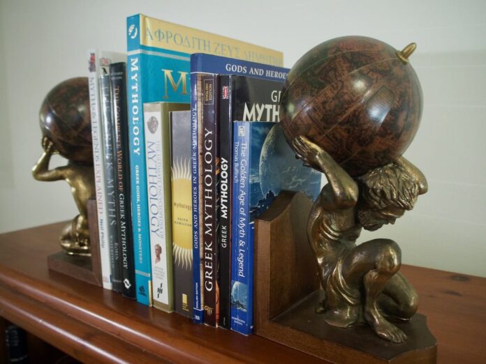 Row of Books about Greek Mythology and Gods held together by Atlas Titan Bookends