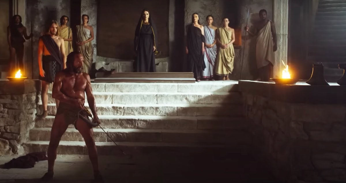 Odysseus preparing to shoot an arrow through the ax heads scene