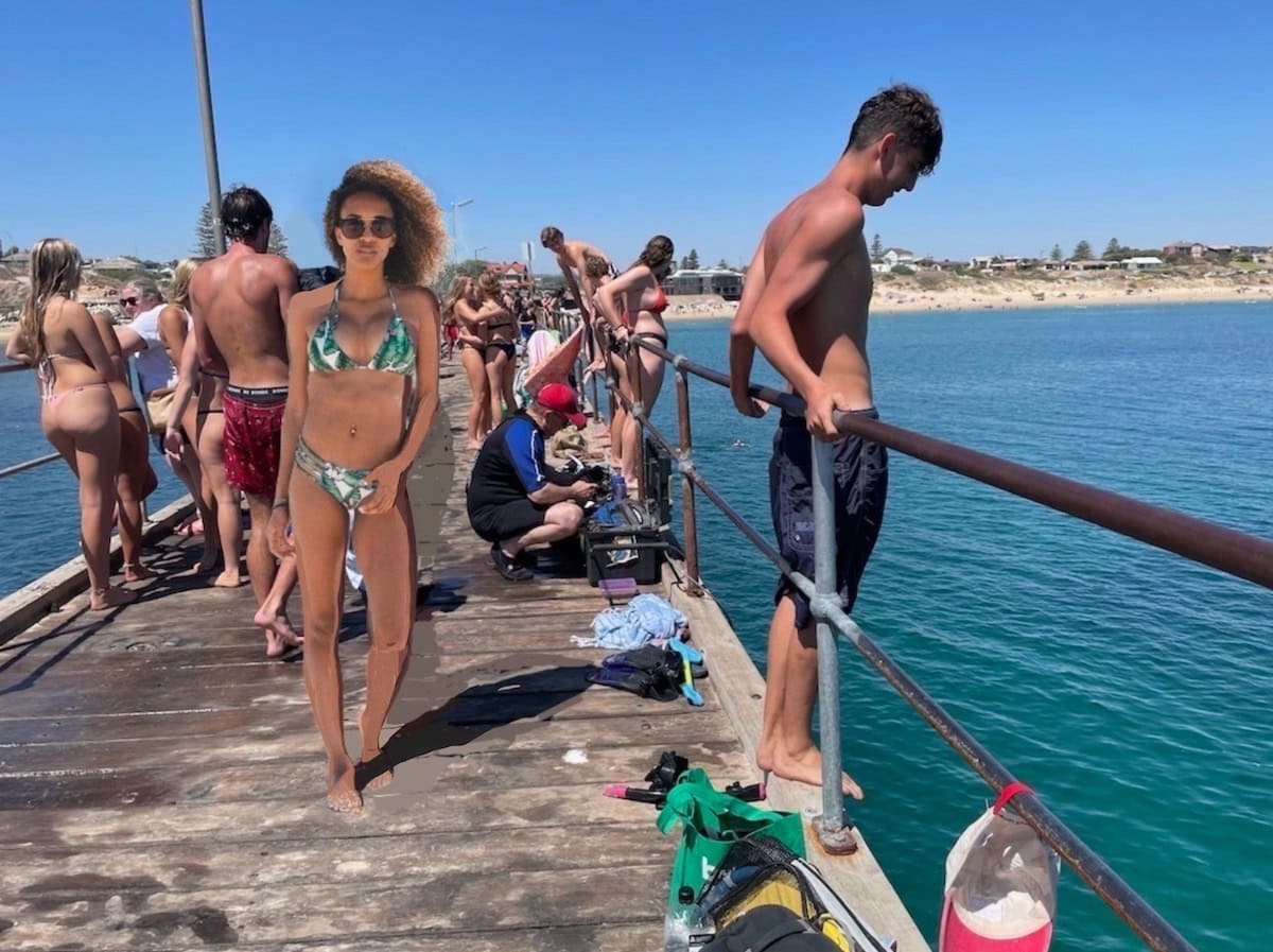 Swimmers about to jump off Port Noarlunga Jetty