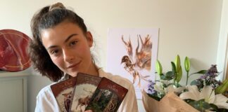 Jaimilee holding Oracle Tarot Cards