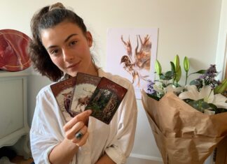 Jaimilee holding Oracle Tarot Cards