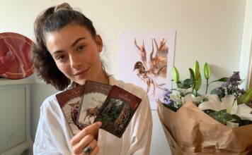 Jaimilee holding Oracle Tarot Cards